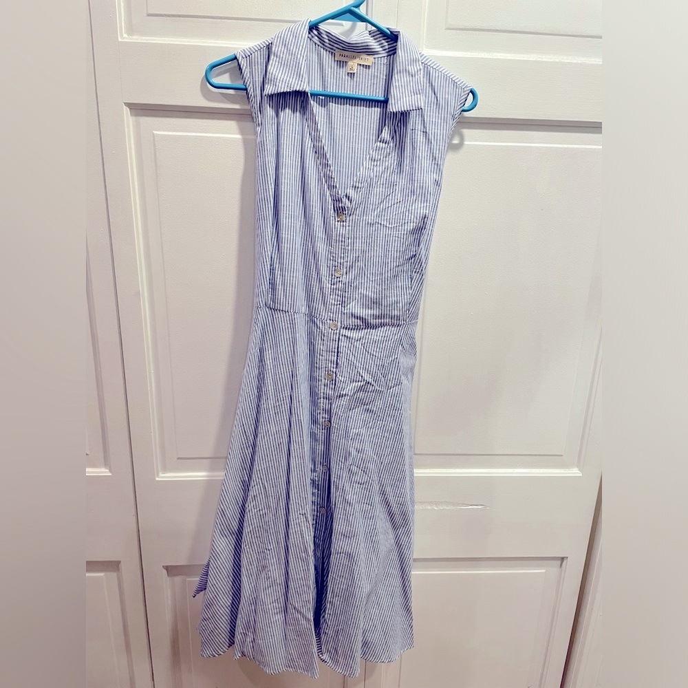 Cotton A-frame, collared dress, full button front with tie behind. Large